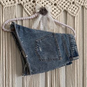 High-rise button-fly shorts. Cut off style